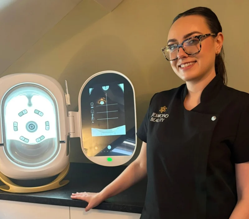 Jesmond beauty specialist stood next to state fo the art Opatra skin scanner machine.